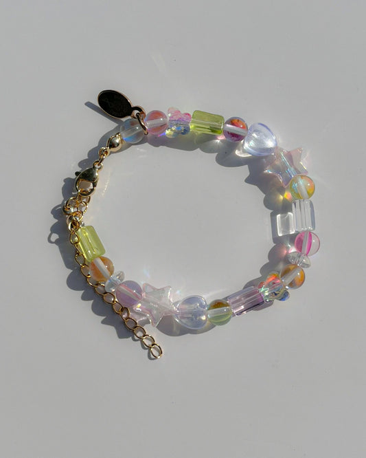 Studio shot of Buttercup Studio's Lucky Charm Aura Bracelet. Made with assorted high quality iridescent and sparkly beads.