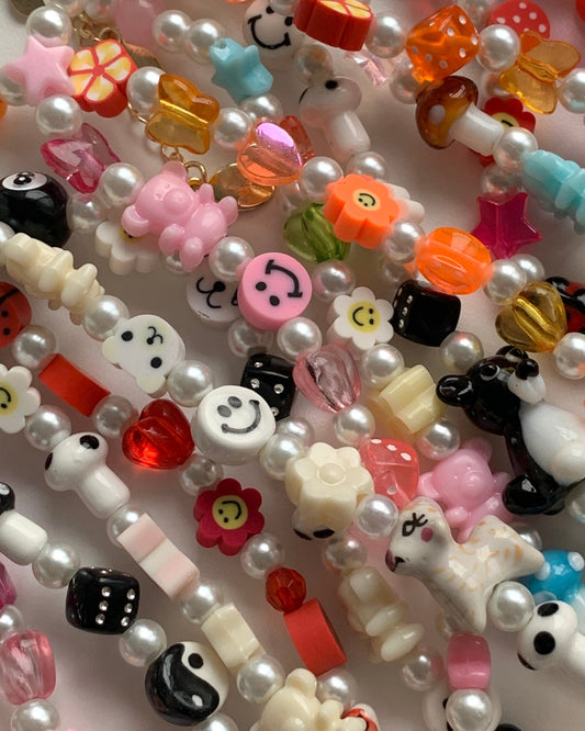 A close of shot of a variety of Custom Regular Pearls Necklaces, made by Buttercup Studio.