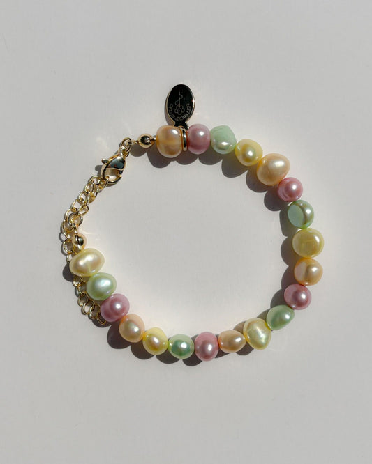 A studio shot of Buttercup Studio's Timeless Pastel Freshwater Pearls Bracelet. Made with assorted colourful hand selected rare freshwater pearls.