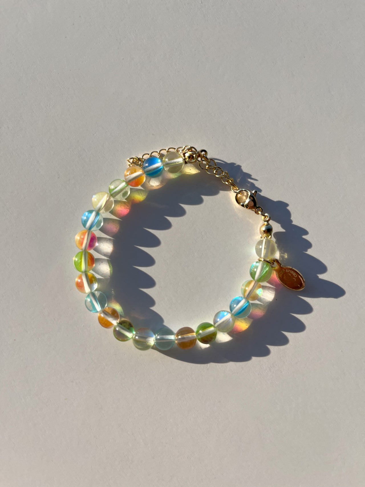 A studio shot of Buttercup Studio's Tropical Bubbly Bubbles Bracelet. Made with assorted colourful glass beads. 