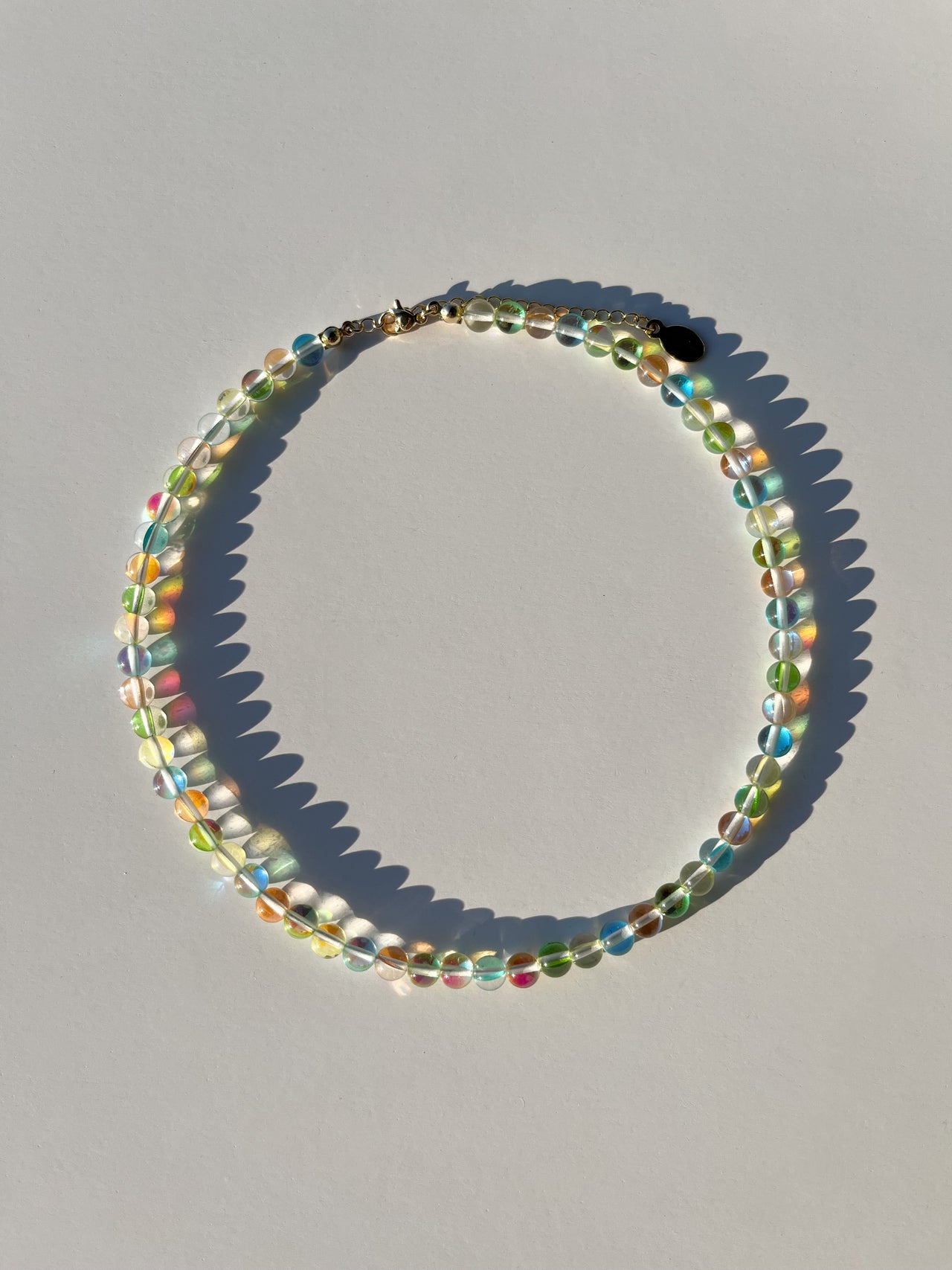 Studio shot of Buttercup Studio's Tropical Bubbly Bubbles Necklace. Made with high quality colourful assorted glass beads. 