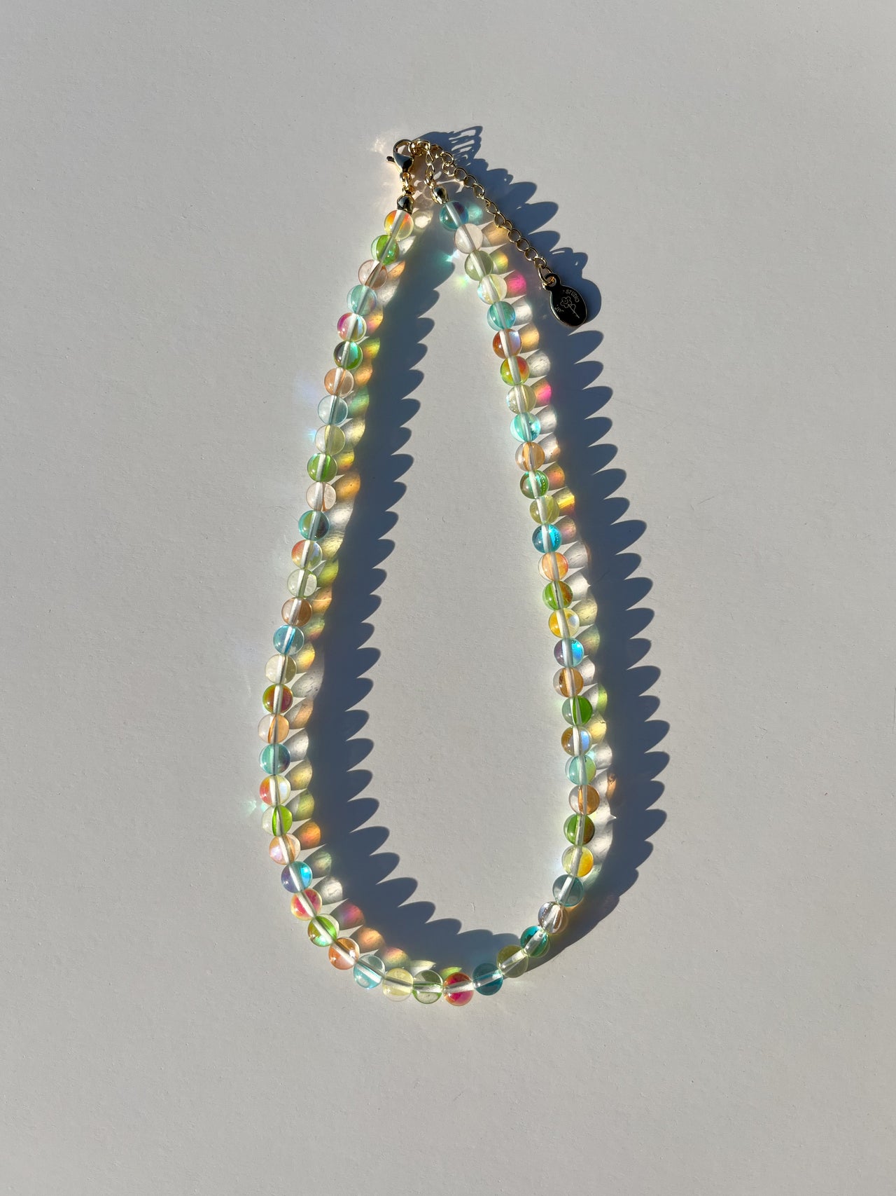 Studio shot of Buttercup Studio's Tropical Bubbly Bubbles Necklace. Made with high quality colourful assorted glass beads. 